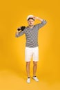 Serious sailor man with binoculars on yellow background Royalty Free Stock Photo