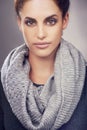 Serious, scarf and portrait of woman for beauty, fashion and clothes with face isolated on gray background. Female Royalty Free Stock Photo