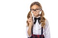 Serious schoolgirl showing a warning finger, back to school again. Royalty Free Stock Photo