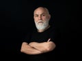 Serious Senior. Satisfied mature man looking at camera isolated on black. Royalty Free Stock Photo
