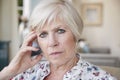 Serious senior woman looking to camera at home, close up Royalty Free Stock Photo