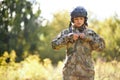 Serious soldier woman wearing jacket in the forest Royalty Free Stock Photo