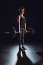 serious sportswoman exercising with barbell at gym Royalty Free Stock Photo