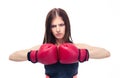 Serious sporty woman with boxing gloves