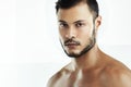 Serious about staying in shape. Cropped studio portrait of an athletic young man posing against a white background. Royalty Free Stock Photo