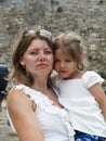 A serious and strict mother holds an alarmed girl looking into t Royalty Free Stock Photo