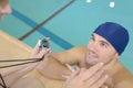 Serious strong male swimming talkin to coach Royalty Free Stock Photo