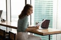 Serious student girl working on research paper, reviewing paper letter Royalty Free Stock Photo