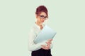 Serious Student with laptop. Closeup woman nerd girl holding books laptop computer slight smile on face, white shirt formal wear,