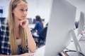 Serious student working on computer