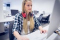 Serious student working on computer