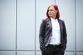 Serious successful red-haired girl boss, businesswoman in suit,