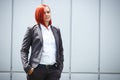 Serious successful red-haired girl boss, businesswoman in suit,