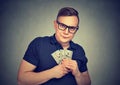 Serious suspicious greedy man with money Royalty Free Stock Photo