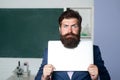 Serious teacher holding laptop, teacher bearded professor with funny expression emotions face. Royalty Free Stock Photo