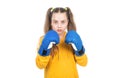 serious teen girl boxer in boxing gloves ready to fight and punch isolated on white, sport