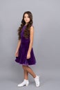 serious teen girl with long frizzy hair in dance ballroom dress full length, dancewear Royalty Free Stock Photo