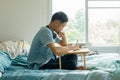 Serious teenage asian boy study at home Royalty Free Stock Photo