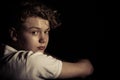 Serious Teenage Boy Looking Back Over Shoulder Royalty Free Stock Photo