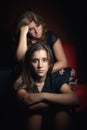 Serious teenage girl and her sad and worried mother Royalty Free Stock Photo