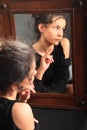 Teenage girl in night dress mirroring in mirror Royalty Free Stock Photo