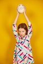 Serious teenager girl holding Ostrich egg with funny face Royalty Free Stock Photo