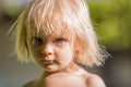 Serious thinking or sad young baby caucasian blonde real people girl close portrait outdoor Royalty Free Stock Photo