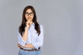 Serious confident indian girl wear glasses look at camera isolate on background Royalty Free Stock Photo