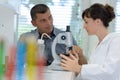 serious thoughtful medical colleagues discussing results in lab Royalty Free Stock Photo