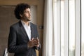 Serious thoughtful young Arab executive man posing in office