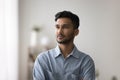 Serious thoughtful young Indian man indoor portrait Royalty Free Stock Photo