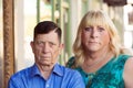 Serious transgender couple standing together