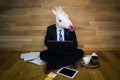 Serious unicorn in a suit and tie enthusiastically works at home office