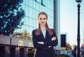 Serious woman crossed arms office building outside Royalty Free Stock Photo