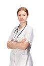 Serious woman in doctor's smock with stethoscope