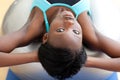 Serious woman doing sit-ups with a pilates ball Royalty Free Stock Photo