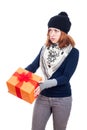 Serious woman with gift