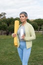 Serious woman with grey hair after training in park Royalty Free Stock Photo