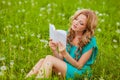 Serious woman reading book outdoors Royalty Free Stock Photo