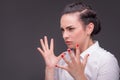 Serious woman wearing white blouse Royalty Free Stock Photo