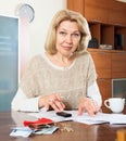 Serious woman woman working with documents money Royalty Free Stock Photo