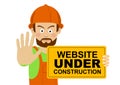 Serious worker man wearing hard hat holding banner with website under construction text showing stop gesture Royalty Free Stock Photo