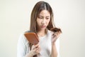 Serious, worried asian young woman, girl holding brush, show her comb, hairbrush with long loss hair problem after brushing, hair Royalty Free Stock Photo