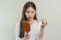 Serious, worried asian young woman, girl holding brush, show her comb, hairbrush with long loss hair problem after brushing, hair Royalty Free Stock Photo