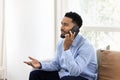 Serious young African American business man talking on mobile phone Royalty Free Stock Photo