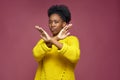 Serious young african american woman show stop finish gesture by crossed hands, protest against racial discrimination Royalty Free Stock Photo