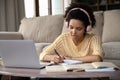 Serious young African Student girl in wireless headphones Royalty Free Stock Photo