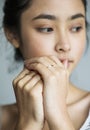 Serious young Asian girl portrait thinking Royalty Free Stock Photo