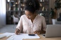 African American woman manage budget paying bills online Royalty Free Stock Photo