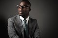 Serious young black man with glasses and gray business suit Royalty Free Stock Photo